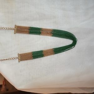 Layered green and gold colored necklace